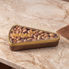 Koçak Pistachio Triangle Box: premium Antep pistachios in an elegant gold triangle tin. Perfect Turkish gift for any occasion. 150g, made in Türkiye.